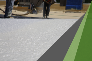 White spray foam that has been applied to a flat commercial roof. SPF is well known to survive disaster conditions.